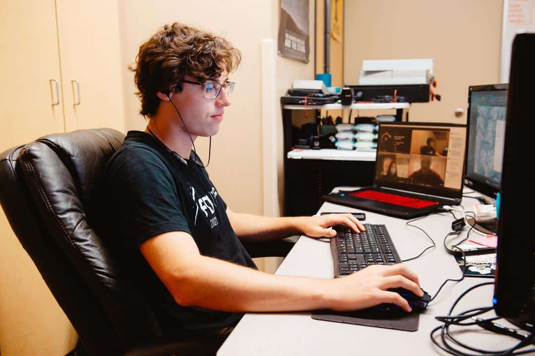 student working on computers in classroom. The computer science program at NNU provides the computer science skills needed to understand operating systems, develop software and improve information security.
