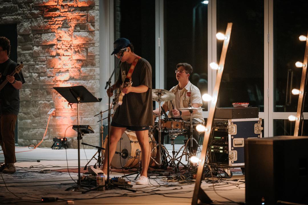 students playing music on instruments