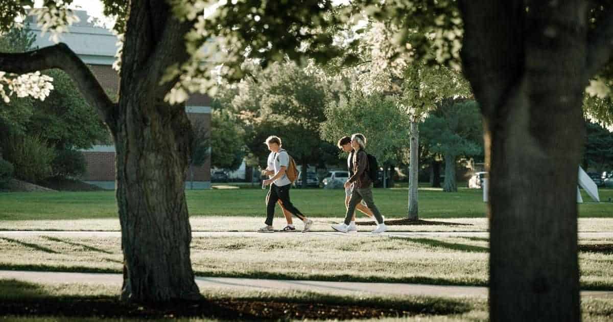 THE COLLEGE ROUTINE AND THE WORK OF GOD - students walking on campus