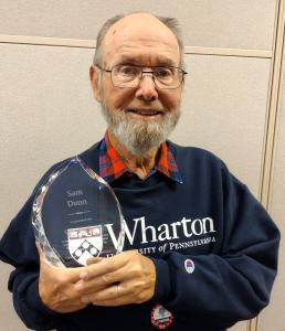 NNU FACULTY AND SENIOR FELLOW AWARDED CHEWNING AWARD - Dr. Sam Dunn pictured holding award