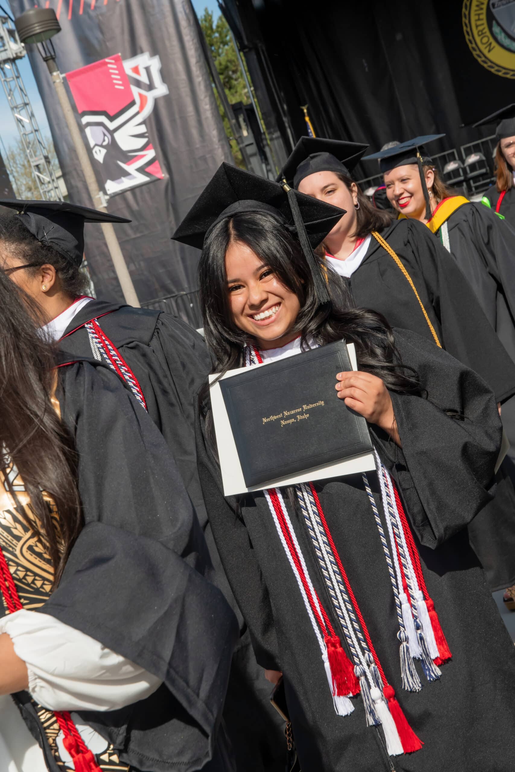 Hispanic student smiling at graduation