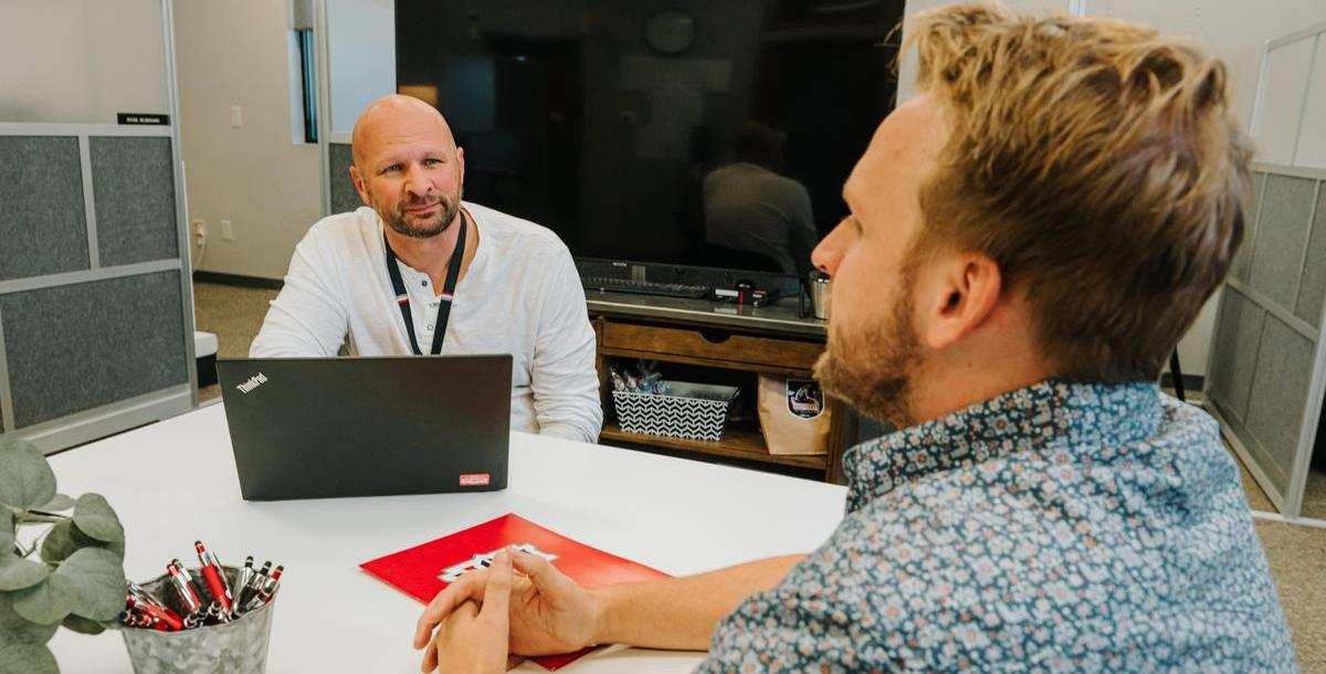 Adult student talks to a graduate admissions counselor