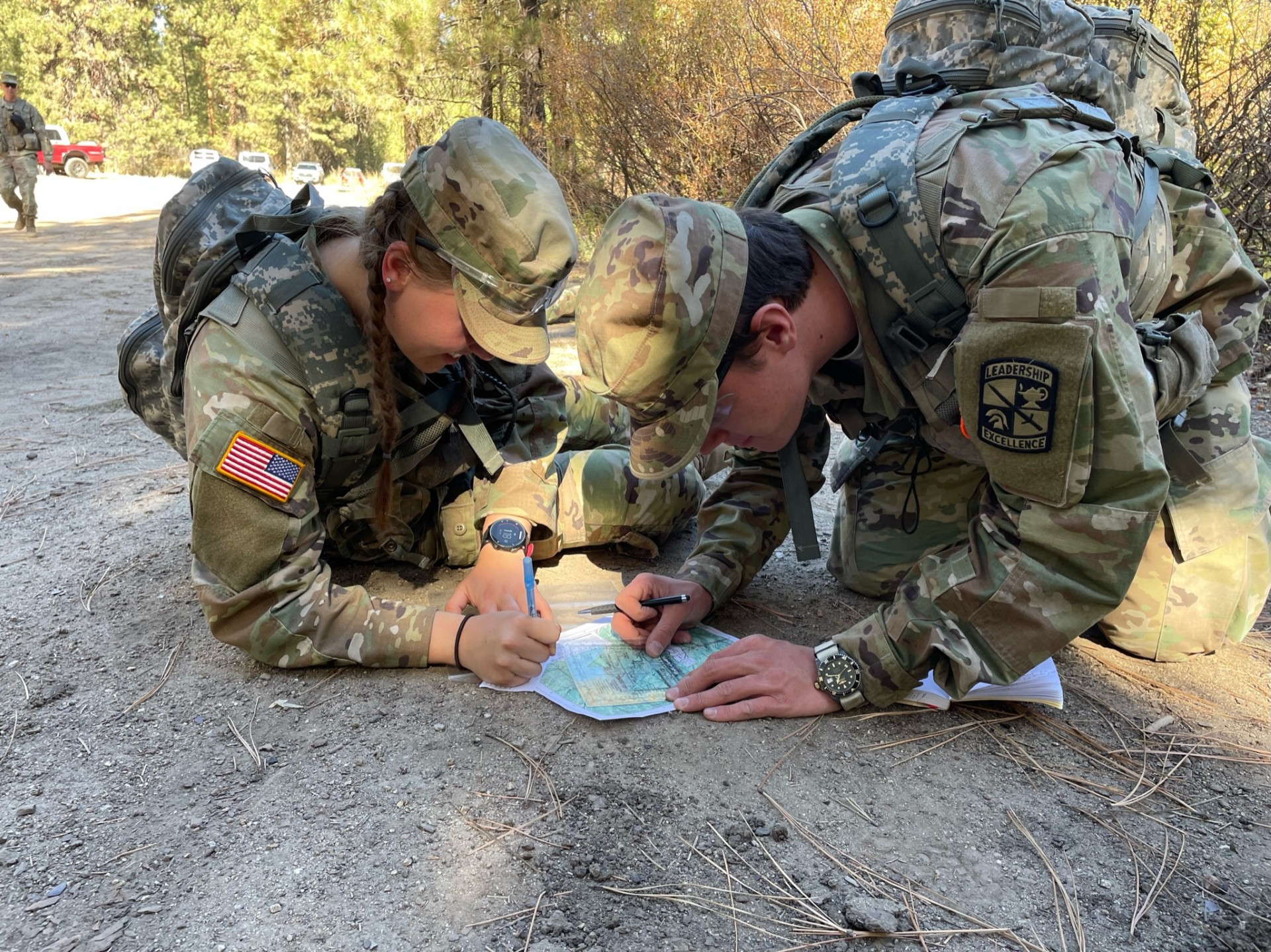 ROTC students going over a map