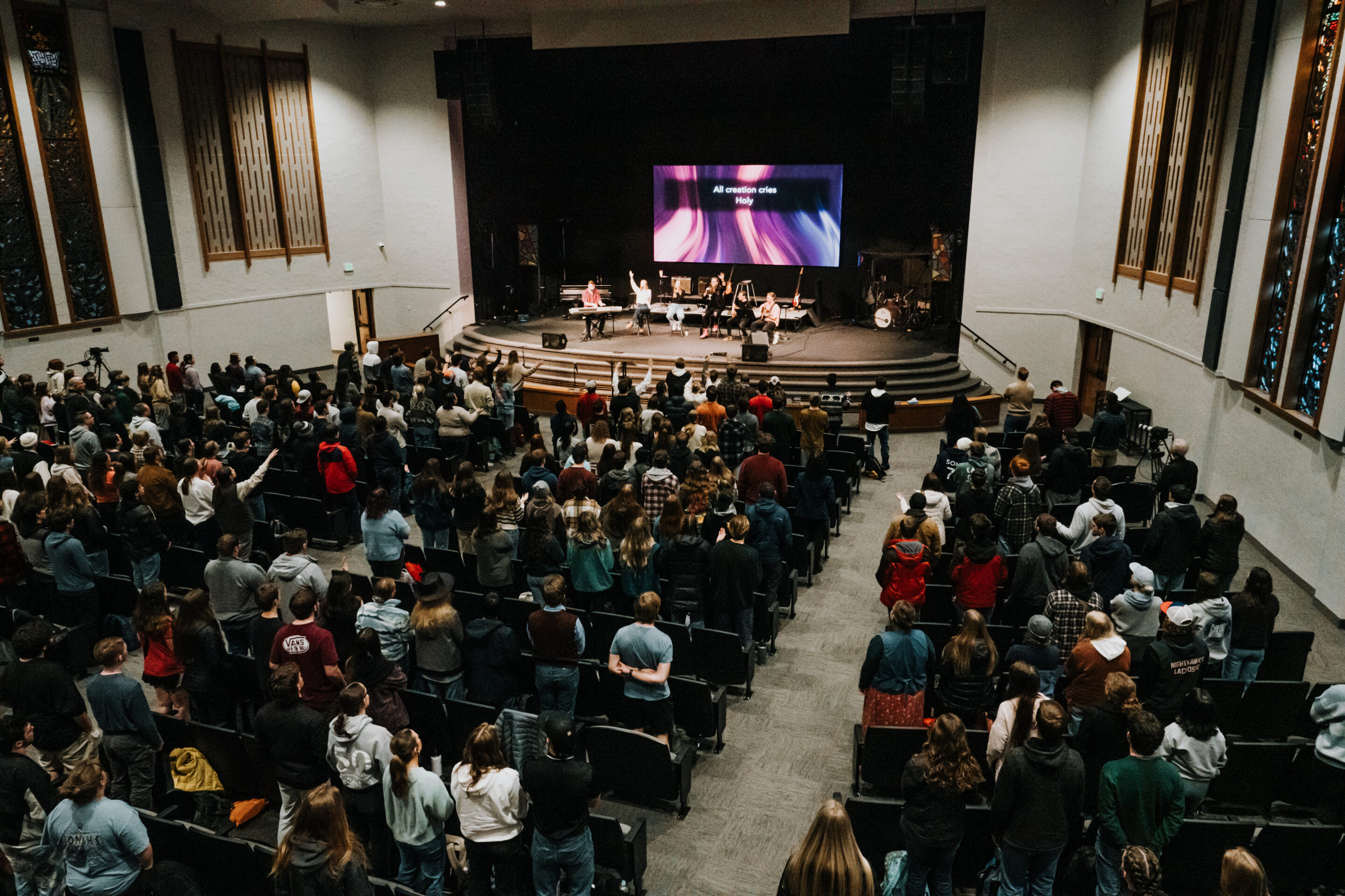 2024_Winter_Awakening_Friday_Chapel_Edits-3 preacher preaching to crowd