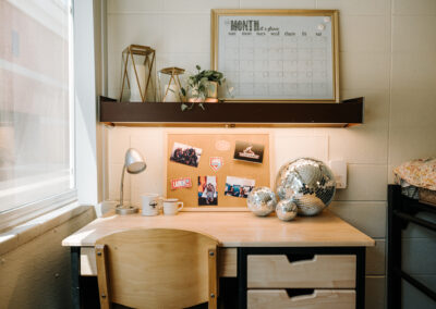 Sutherland room picture; desk and shelf with decorations