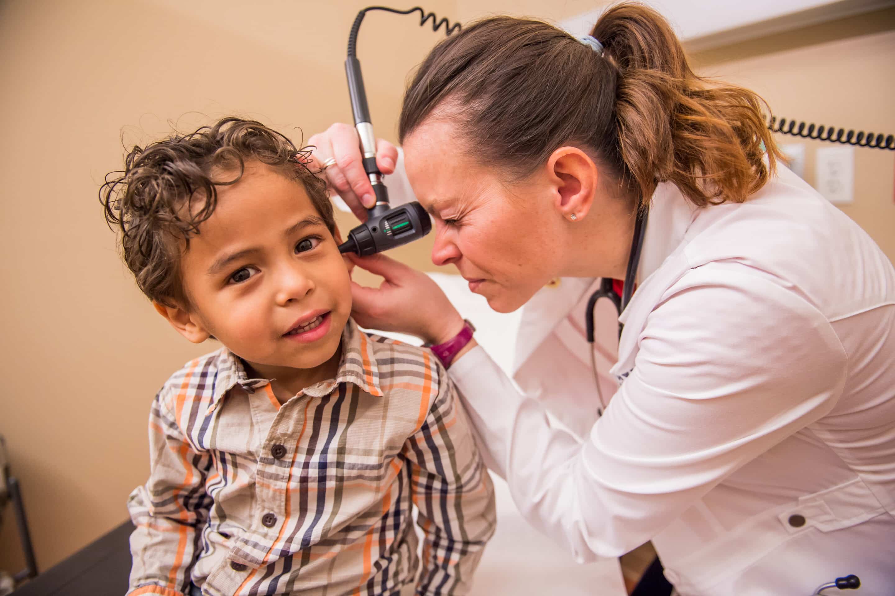 students helping another student pick the best cover design for a book