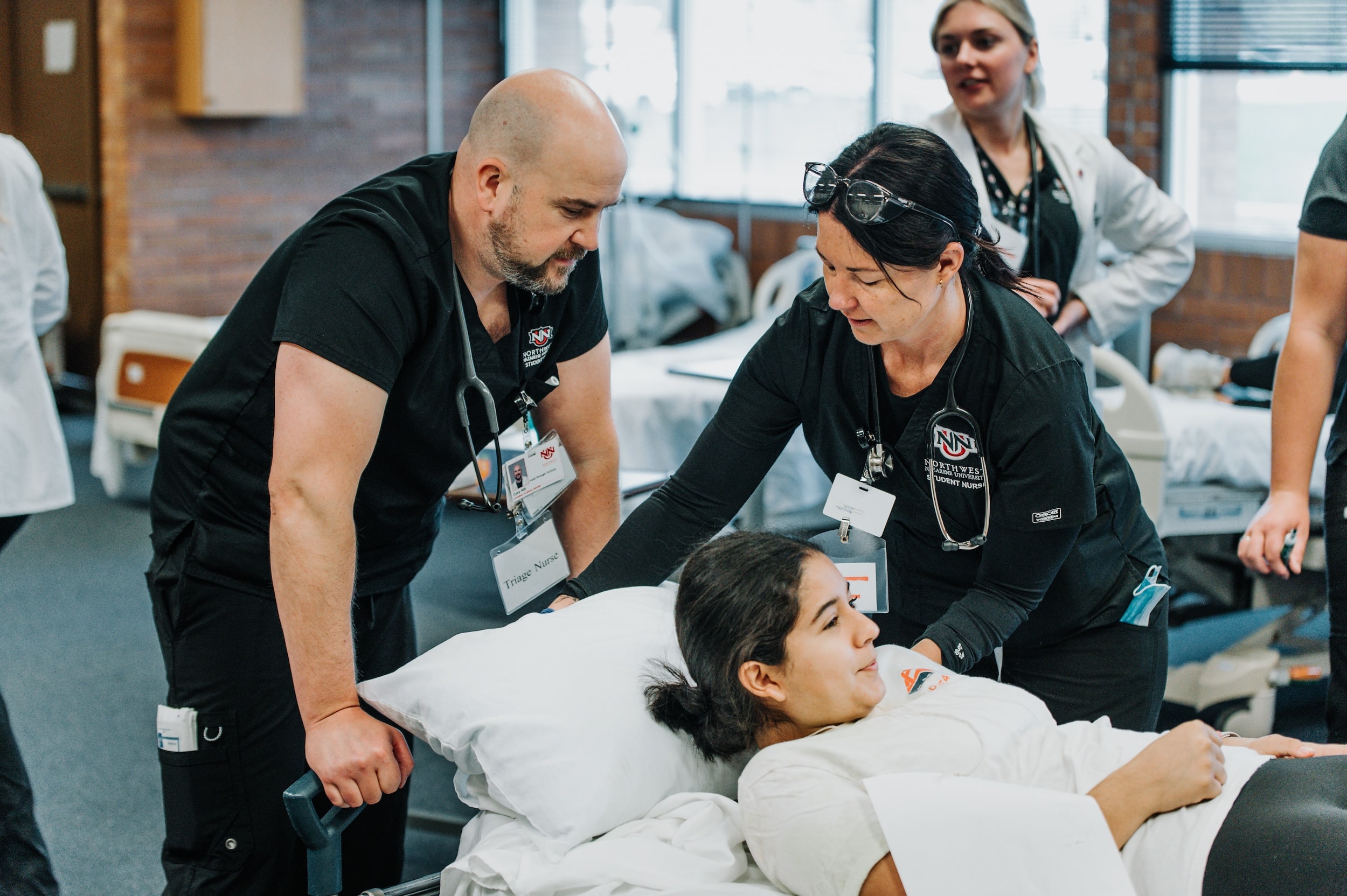 NNU-70 (1) Nursing students with a student "patient" on a gurney