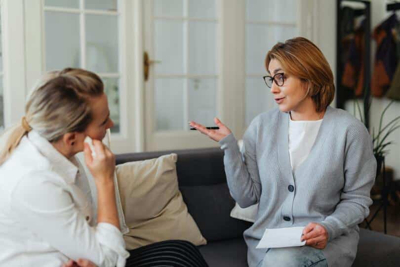 Female counselor talks with female client