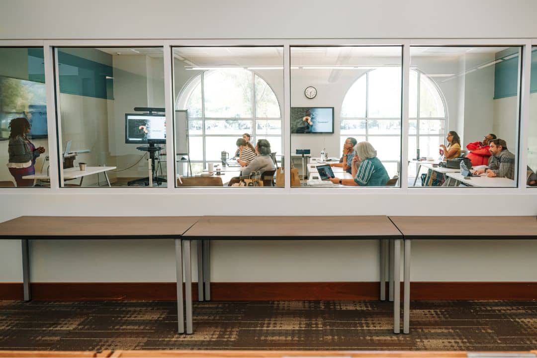 Doctoral students presenting dissertation