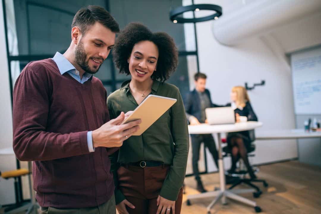 Male and Female coworkers collaborating on a project.