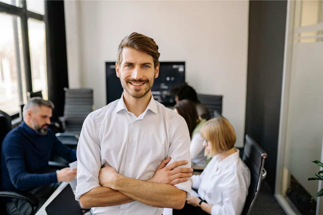 Male Adult standing in a corporate office
