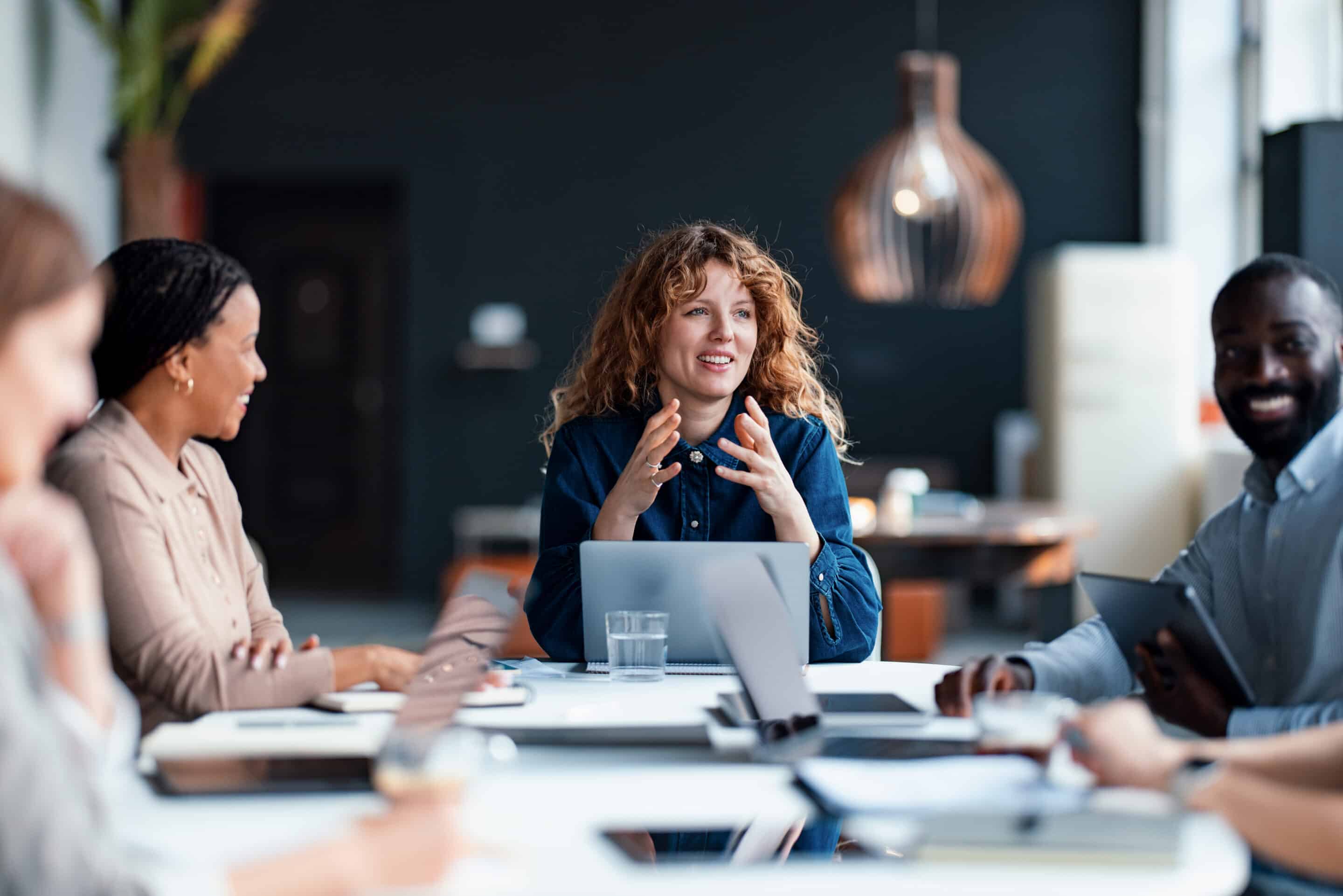 Diverse Team Collaborating in a Modern Office Setting During a Discussion