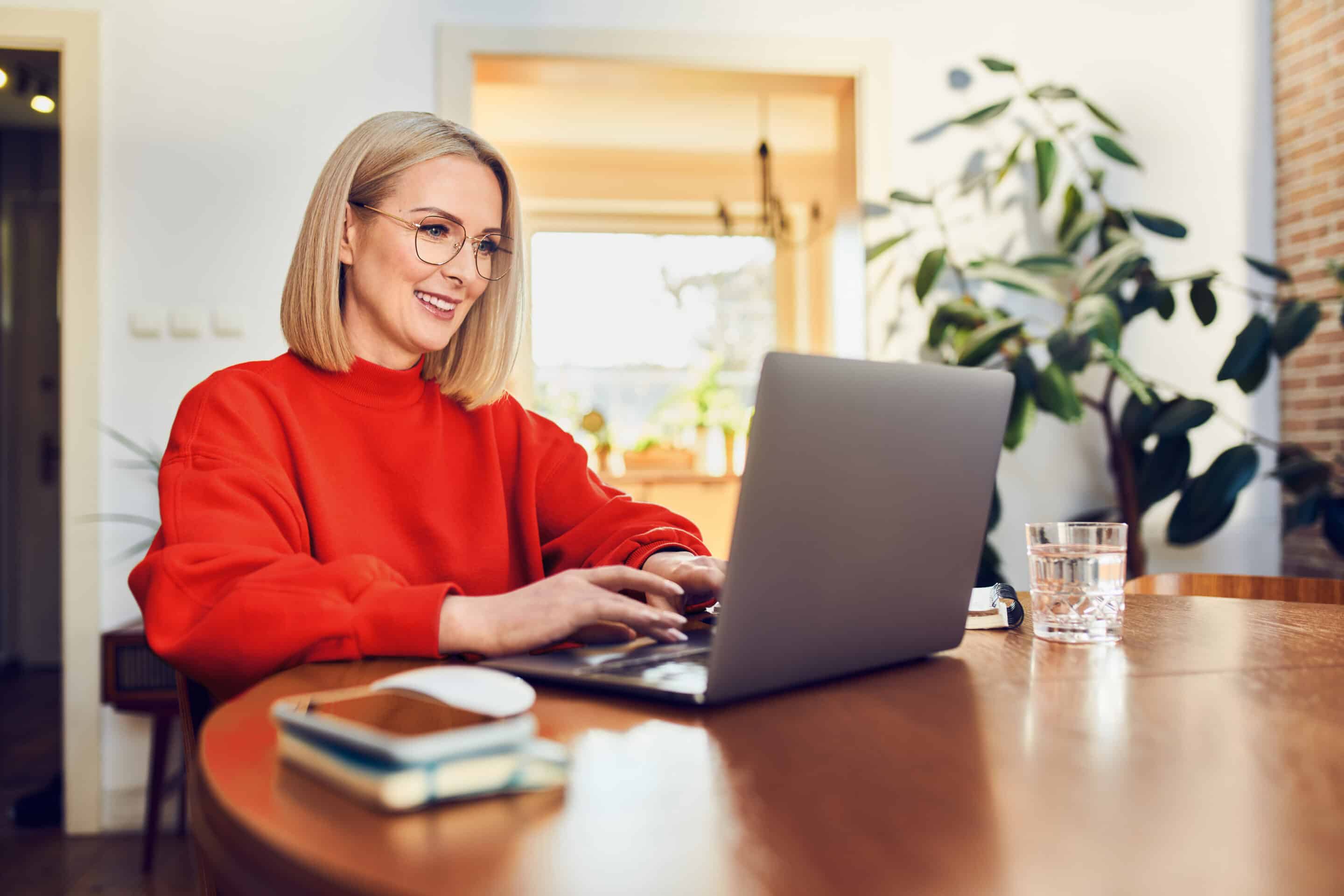 Woman Middle Age sweater on computer