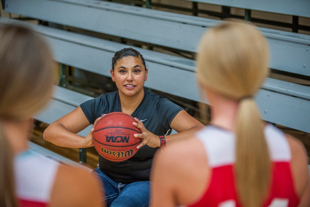 Female coach working with athletes