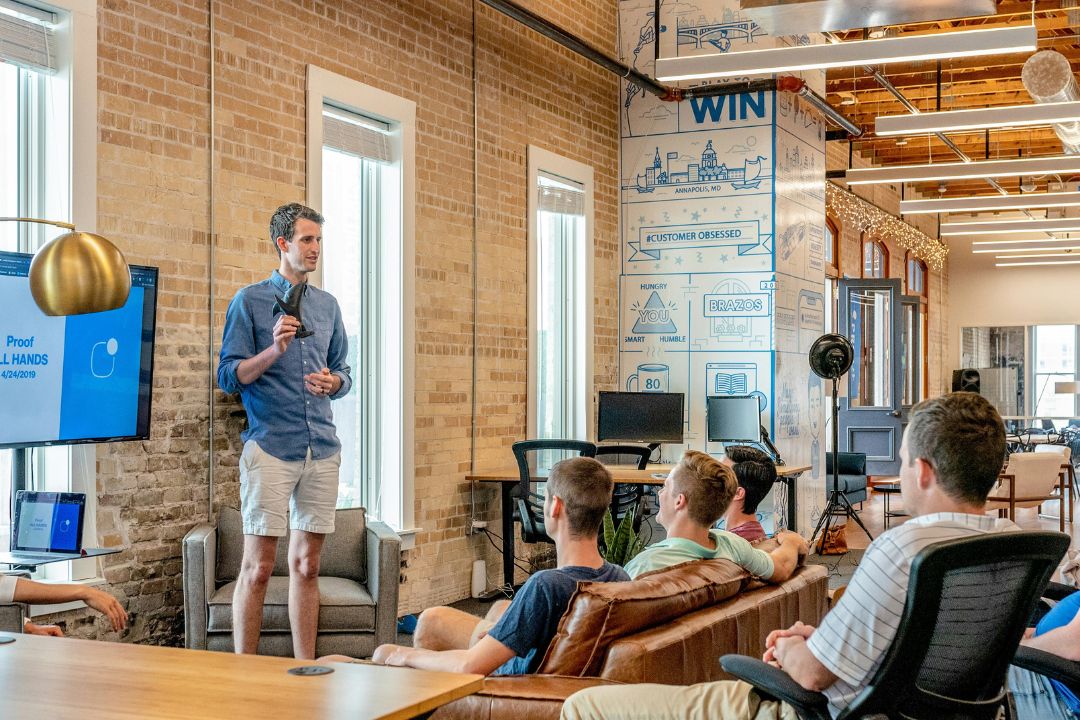Male professional leading a team meeting