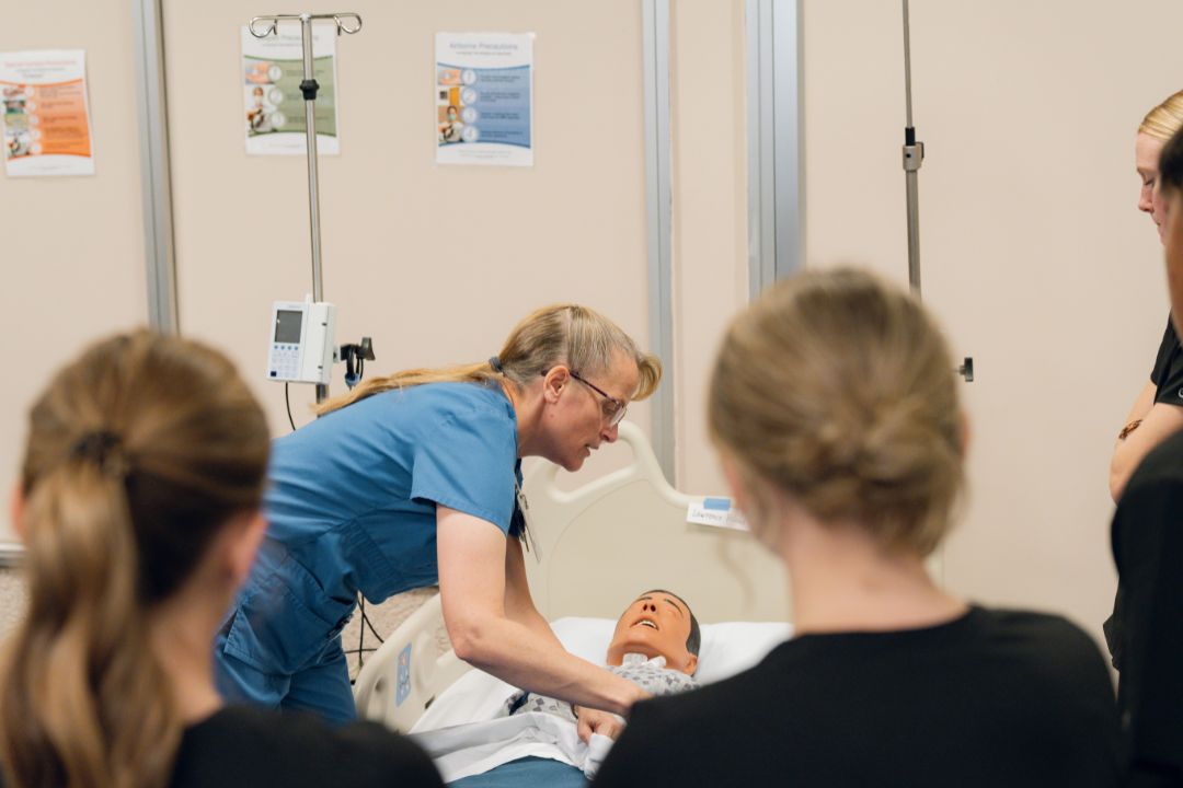 Female Professor teaching nursing students