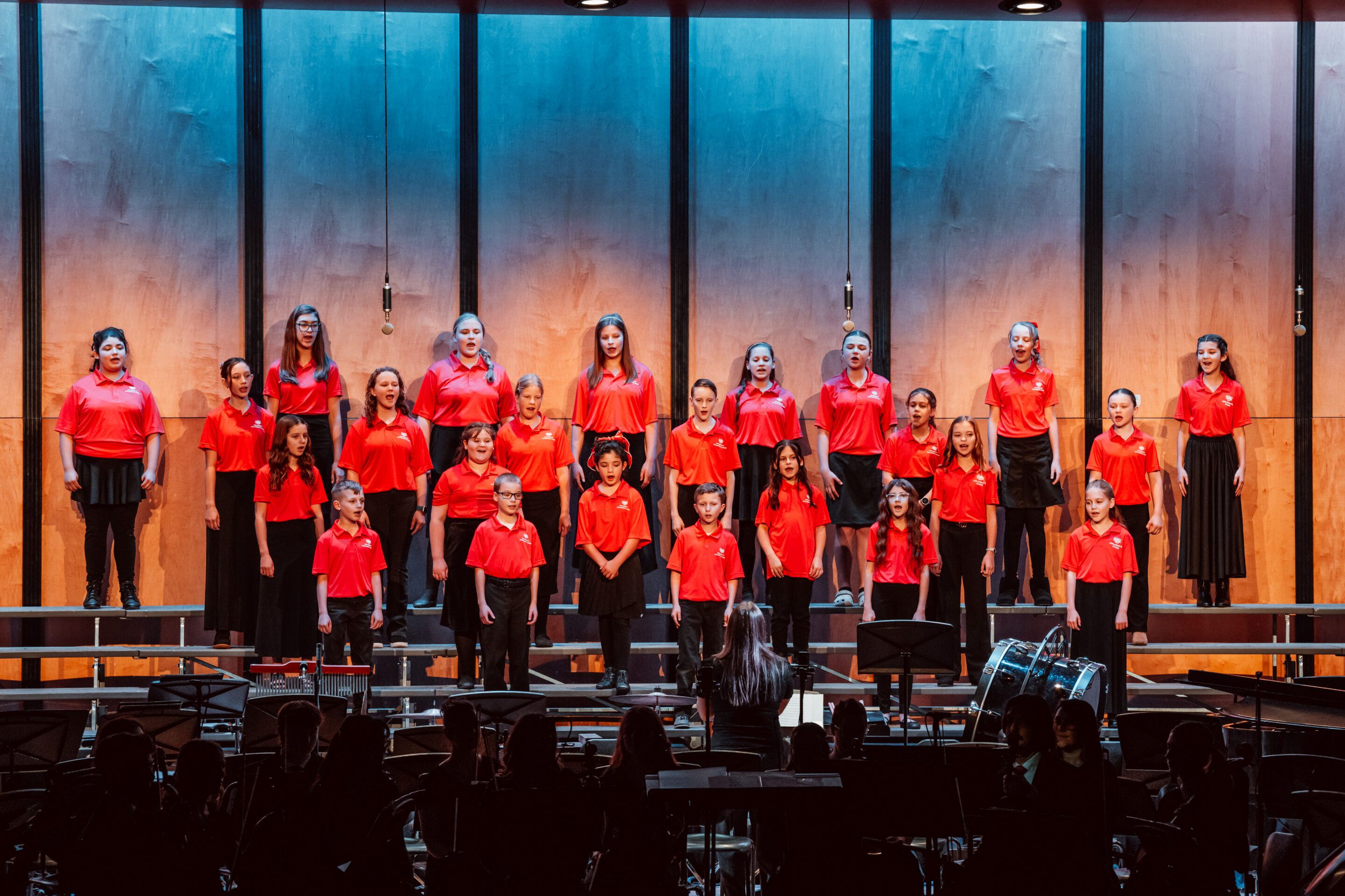 university childrens choir singing on stage